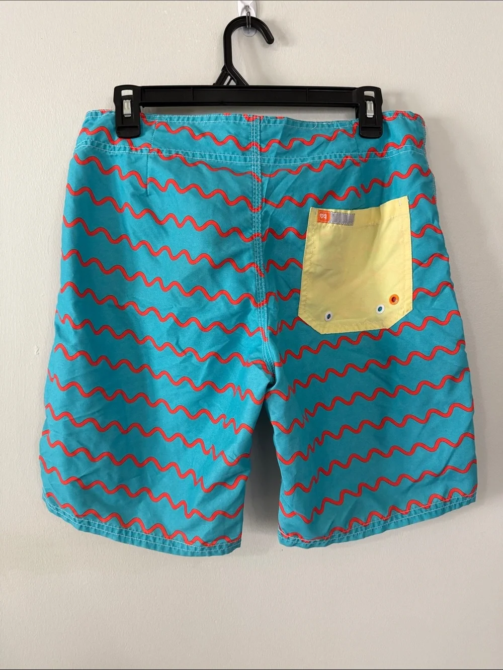 Men's Turquoise Swim Trunks with Red Wave Pattern